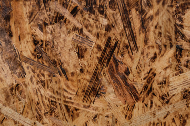 Holzmaterial. Textur aus geräucherten Spanplatten (Faserplatten). - Foto, Bild