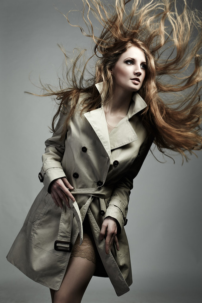 Fashion portrait of young beautiful woman in the raincoat - Fotografie, Obrázek