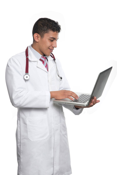 Young Latino Doctor with white coat and white stethoscope  on white background. - Foto, imagen
