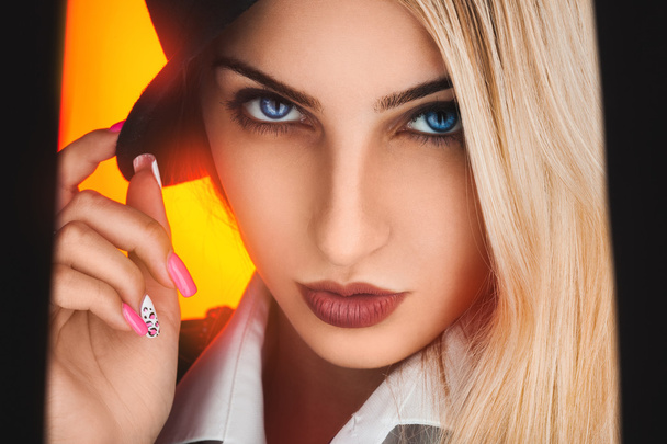 Fashionable portrait of sexy blonde woman with blue eyes on yell - Fotoğraf, Görsel