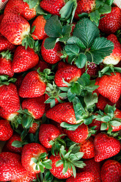 ripe red strawberry in a wooden box. strawberry background. strawberry top view - Φωτογραφία, εικόνα