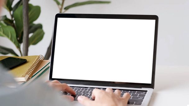 Laptop computer screen mockup, template background, Man hand typing laptop computer with blank screen, Business online, e commerce, online study concept  - Foto, afbeelding