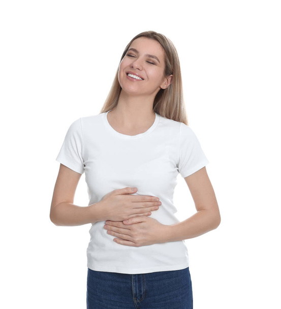 Happy woman touching her belly on white background. Concept of healthy stomach - Foto, imagen