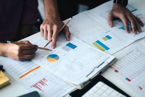 Financial Business team present. Business man hands hold documents with financial statistic stock photo, discussion, and analysis report data the charts and graphs. Finance Financial concept - Φωτογραφία, εικόνα