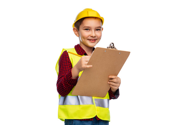 little boy in helmet with clipboard and pencil - Foto, Imagem