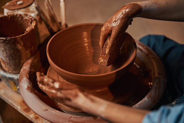 Fascination process of shaping ceramic tableware in pottery workshop - Fotoğraf, Görsel