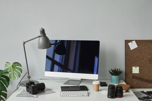 Minimal background image of photographers workplace with computer setup for photo editing, copy space - Photo, Image