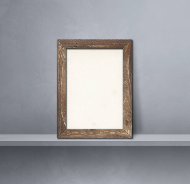 Wooden picture frame leaning on a grey shelf. 3d illustration. Blank mockup template. Square background - Foto, Imagen