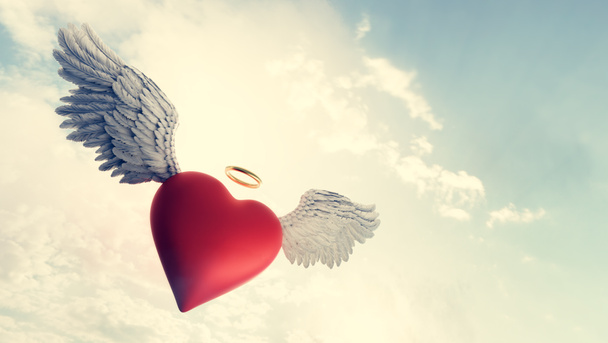Srdce s andělskými křídly a zlatým prstenem symbol lásky létající v oblacích. Valentýnské téma. 3D ilustrace - Fotografie, Obrázek