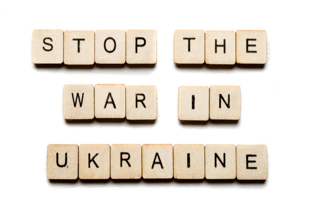 Concept on the War in Ukraine showing a sign reading Stop The War In Ukraine - Fotoğraf, Görsel