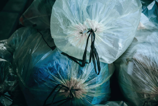 garbage bags on a street in the city - Фото, изображение