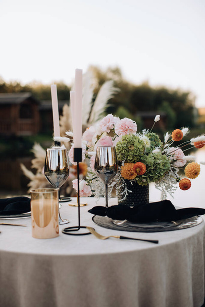 Organize a romantic dinner for two outside in the boho style - Zdjęcie, obraz