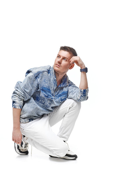 handsome young man in Jean jacket on white background - Zdjęcie, obraz