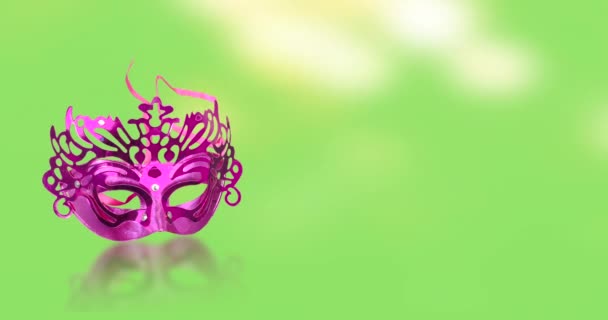 Концепція єврейського фестивалю Пурім. Карнавальна маска з бокевим ефектом на зеленому фоні. - Кадри, відео