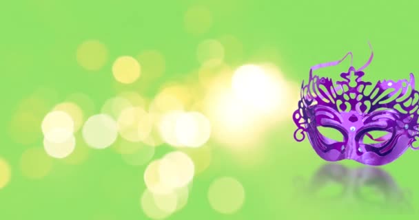 Frohes Purim. Das Konzept des jüdischen Purimfestes. Karnevalsmaske mit Bokeh-Effekt auf grünem Hintergrund. - Filmmaterial, Video