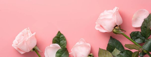 Mother's Day design concept background with pink rose flower on pink table background background - Zdjęcie, obraz