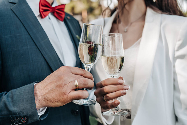 Glasses of champagne in people's hands  - Photo, Image