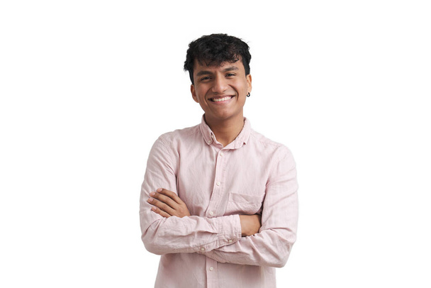 Young peruvian man smile wearing a pink shirt stand with arms crossed, isolated. - Photo, Image