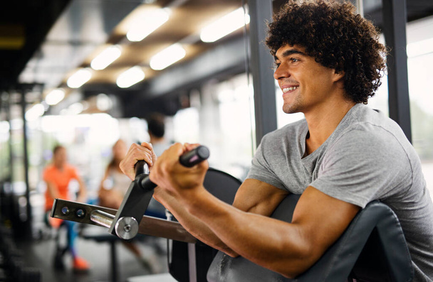 Portrait of healthy man working out in gym - Фото, зображення