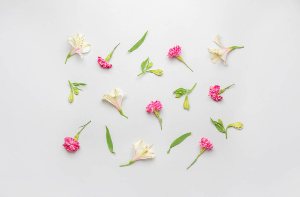 Composition with beautiful carnation and alstroemeria flowers on white background - Fotografie, Obrázek
