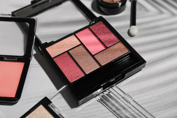 Makeup products on grey background, closeup - Фото, зображення