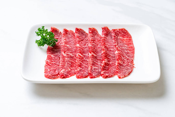 fresh beef raw sliced with marbled texture served for Sukiyaki and Shabu or Yakiniku - Zdjęcie, obraz