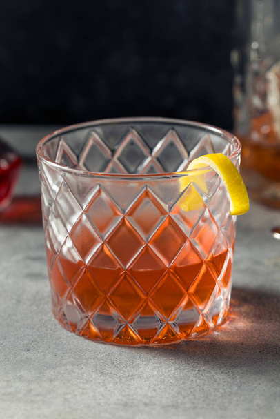 Boozy Refreshing Rye Whiskey Sazerac Cocktail with a Lemon Garnish - Фото, изображение