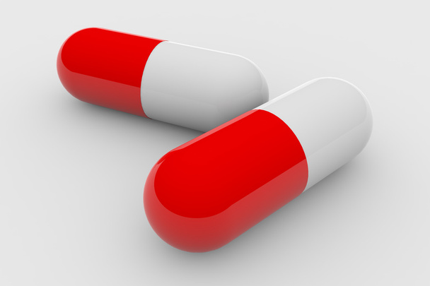 Two red and white pills - Foto, afbeelding
