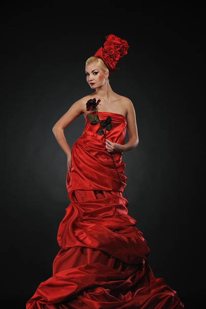 Beautiful lady with a red rose - Valokuva, kuva