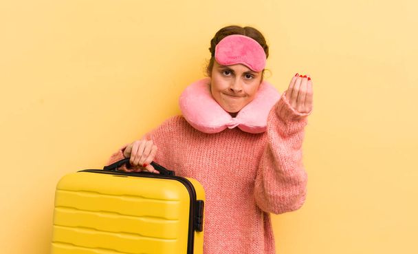 young pretty woman making capice or money gesture, telling you to pay. flight passenger concept - 写真・画像