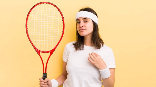 young hispanic woman looking arrogant, successful, positive and proud. tennis concept - Foto, Imagem