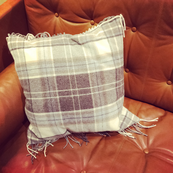 Leather sofa with checked cushion - Photo, Image