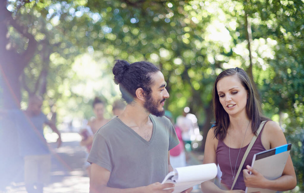 Catching up before the next class. Cropped shot of a male and female student on campus. - Foto, imagen