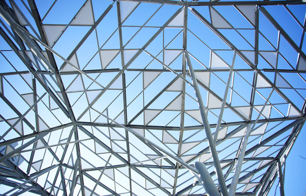 Decorative roof in the shape of a triangle in a park square with a clear blue sky                                - Foto, Imagem