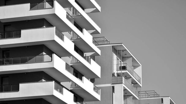 Fragment of modern residential apartment with flat buildings exterior. Detail of new luxury house and home complex. Black and white filter. - Photo, Image