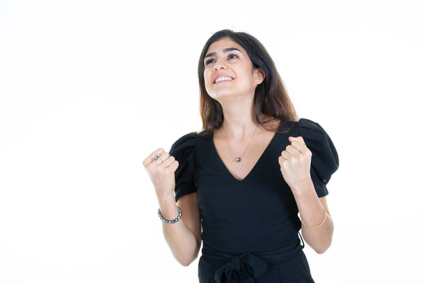 femme profiter mains serrées poing fermé heureux avec joie avec les mains levées - Photo, image