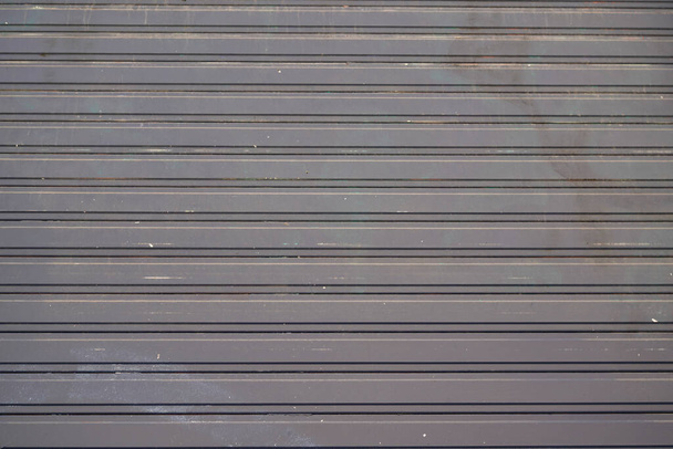 Фоновый рисунок серого стального магазина металлический занавес шаттл прокатки затвор металлические ворота серый фон - Фото, изображение