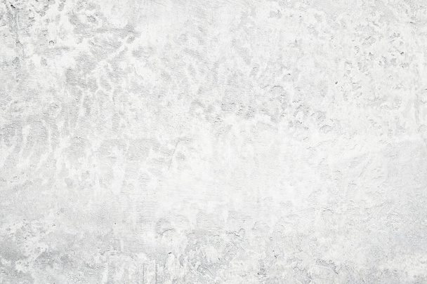 светло-бетонная текстура, красивый антикварный узор на бетонной стене в белых и темных тонах - Фото, изображение