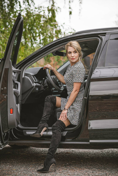 Gorgeous woman with a car, luxury style, concept lady and automobile - Fotografie, Obrázek