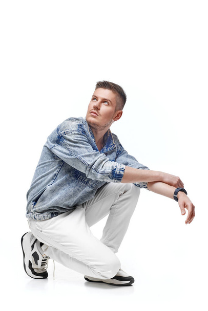 handsome young man in Jean jacket on white background - Фото, изображение