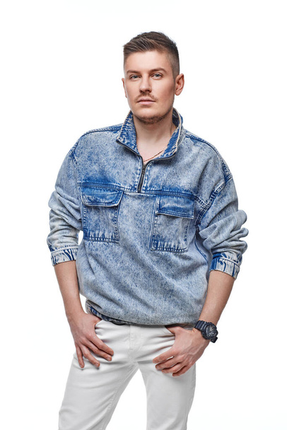handsome young man in Jean jacket on white background - Foto, afbeelding