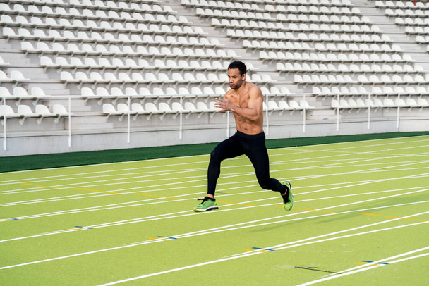 Side View of Athlete Doing Sprint - Foto, imagen