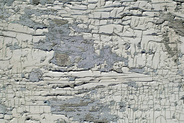 Um padrão bizarro de rachado, descascando pintura velha de perto - Foto, Imagem