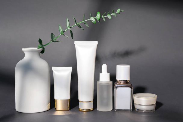moisturizing cream bottle over black background studio, packing and skincare beauty concept - Foto, Imagen