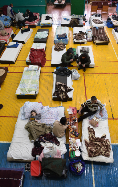 Lviv, Ukraine - March 10, 2022: Refugees rest in a gym of Lviv Polytechnic National University in the Western Ukraine. - Zdjęcie, obraz