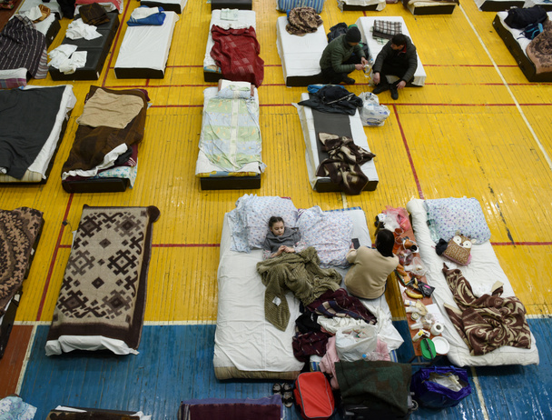 Lviv, Ukraine - March 10, 2022: Refugees rest in a gym of Lviv Polytechnic National University in the Western Ukraine. - Photo, Image