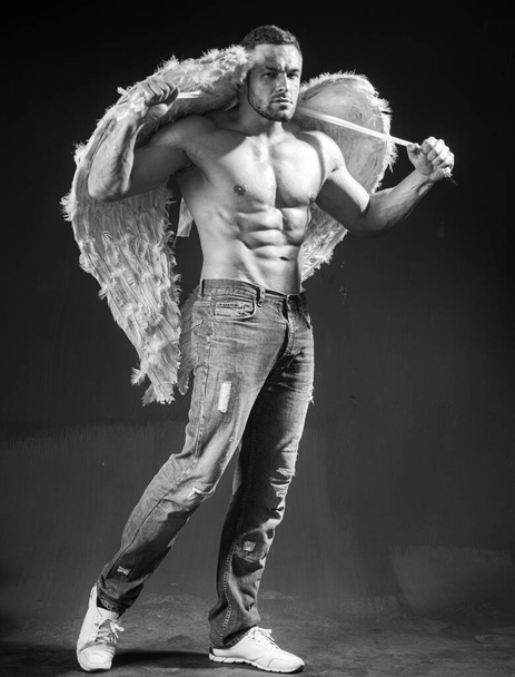 Handsome muscular, naked male angel with wings. Sexy athlete angel man. Valentines day. - Fotó, kép