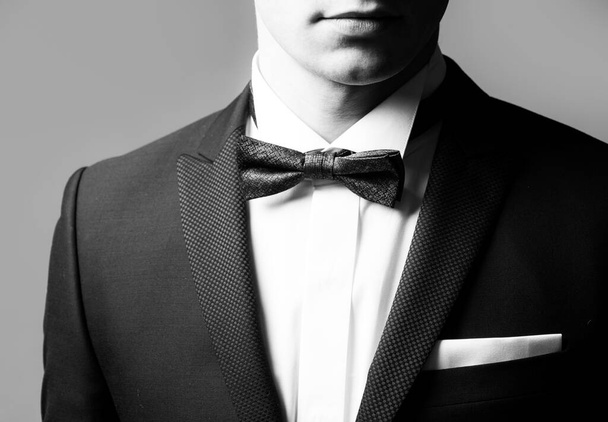Elegant male fashion. Black suit. Gentleman in black suit. Classic formal stylish clothes. - Фото, зображення