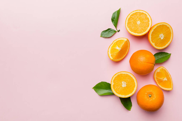 fresh Fruit orange slices on colored background. Top view. Copy Space. creative summer concept. Half of citrus in minimal flat lay with copy space. - Photo, Image