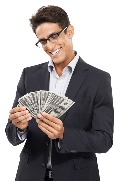 Making money. Studio shot of a handsome young businessman isolated on white. - Foto, afbeelding